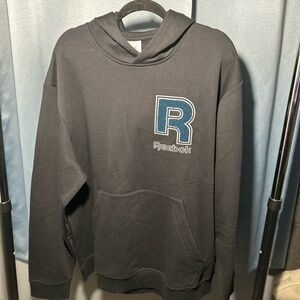 Reebok pull over 
black & hints of green 
BRAND NEW